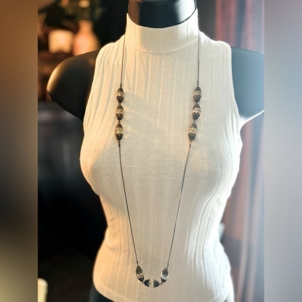 Long silver necklace with beads